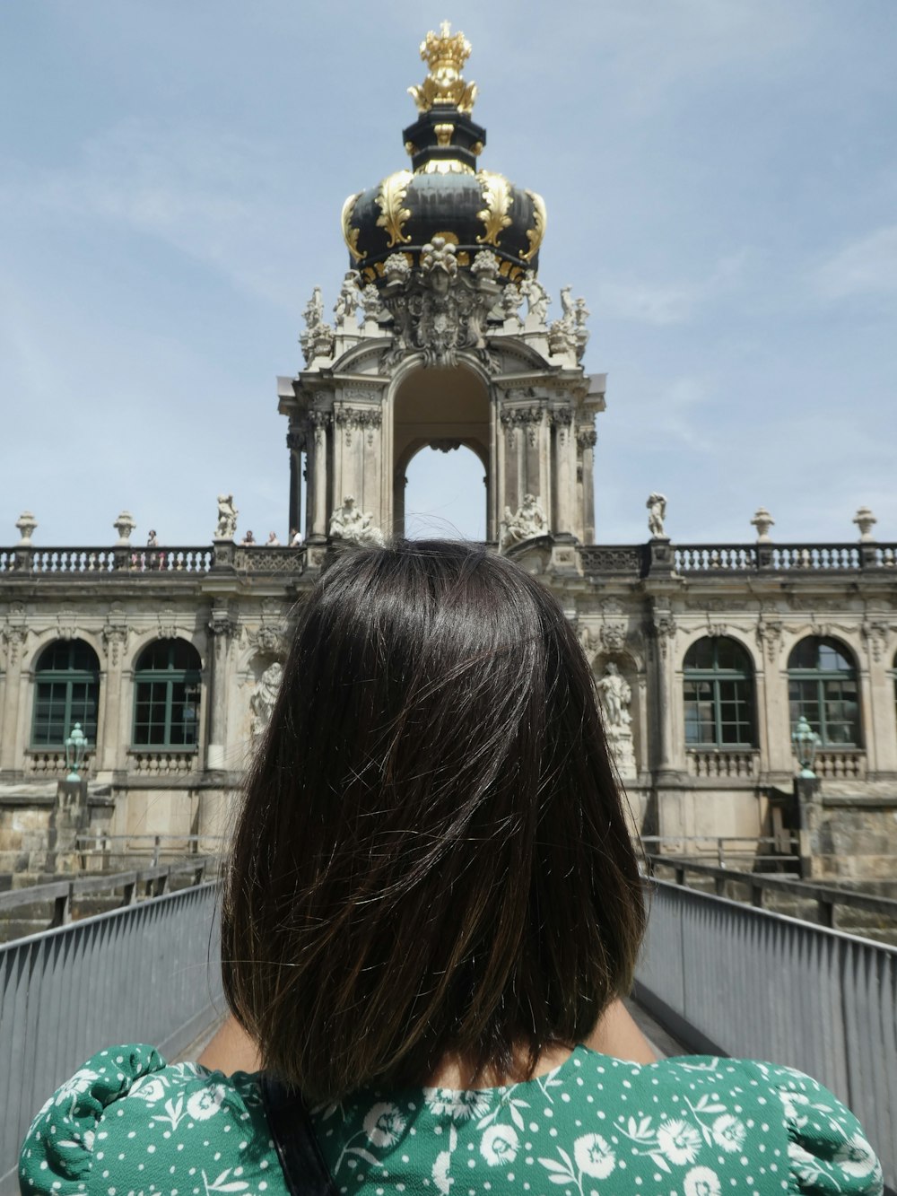 woman standing in front of medieval building