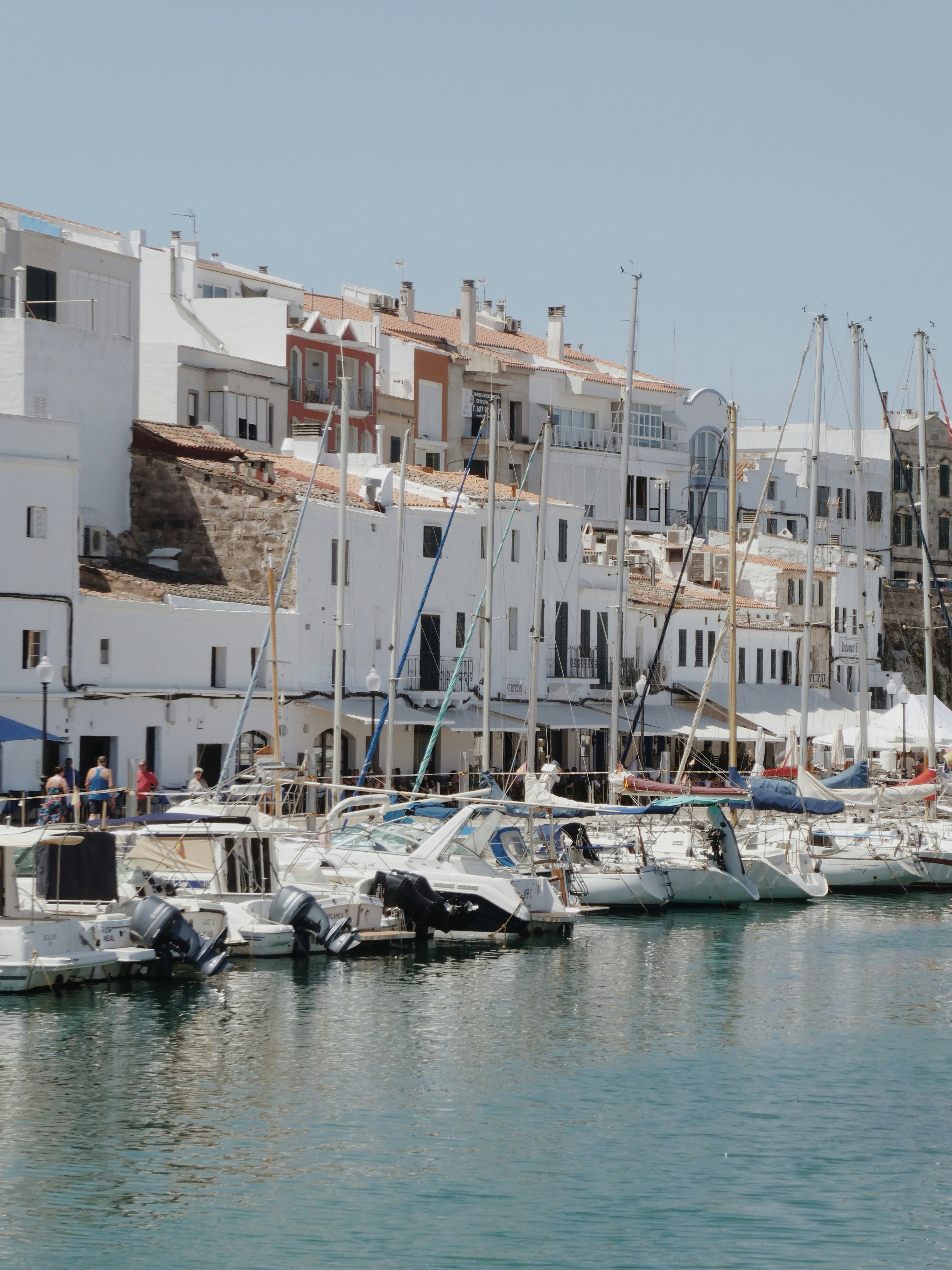 white boats on body of water during daytime