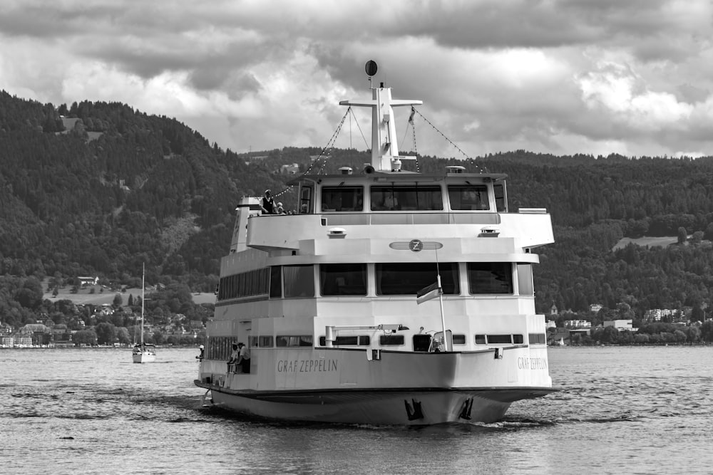 grayscale photo of cruise ship on body of water
