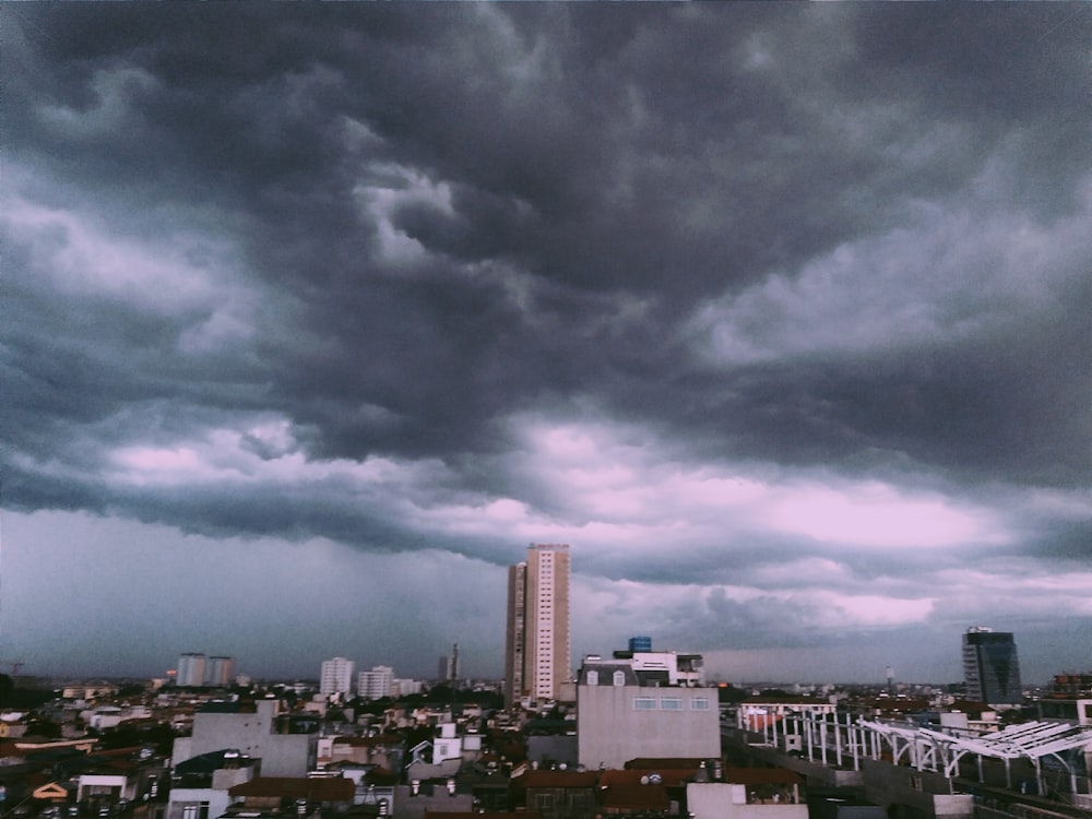 city buildings under cloudy sky