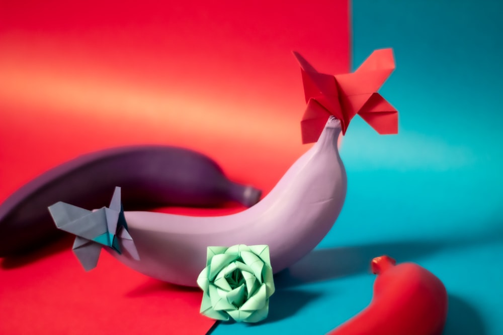 purple-painted banana with origami