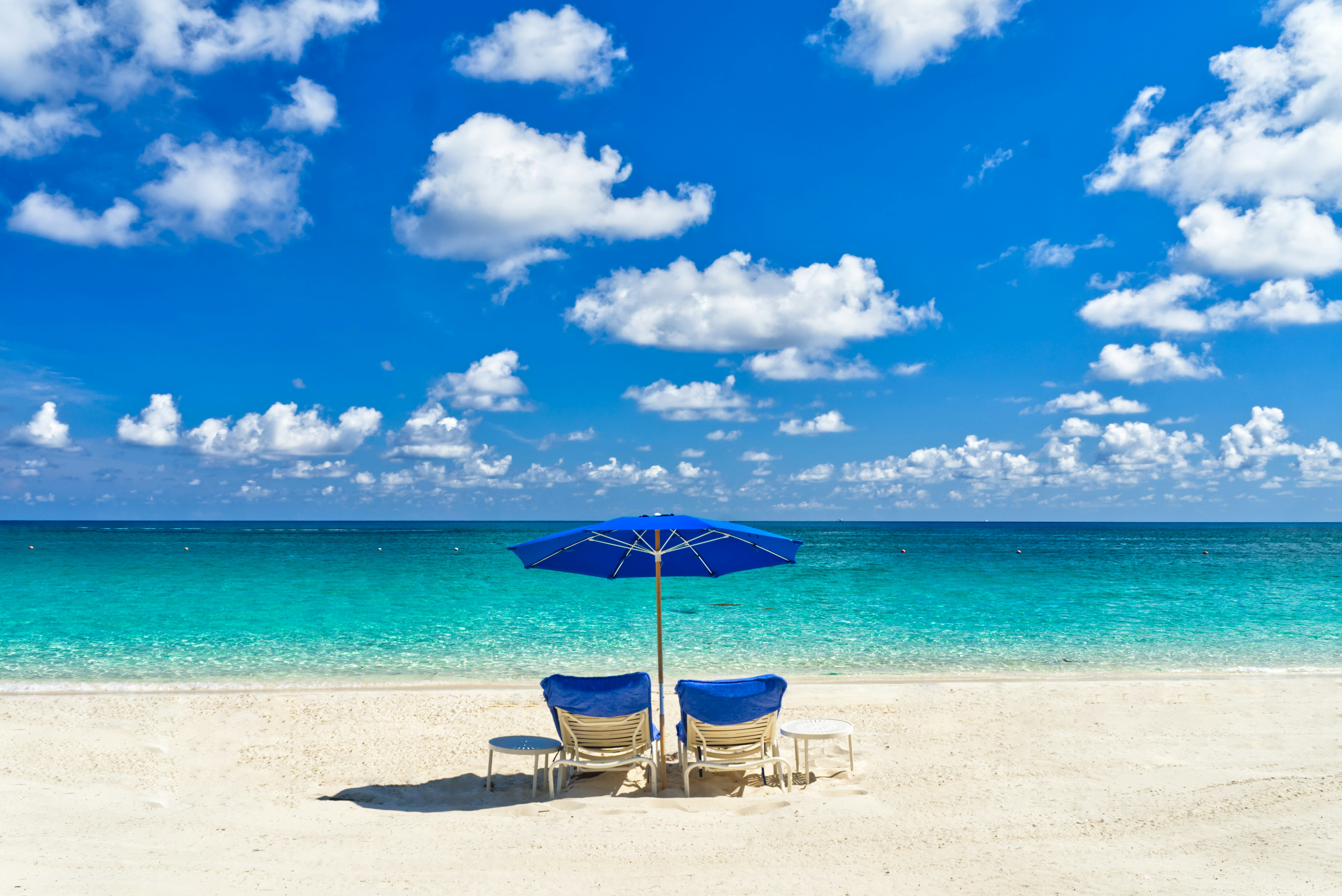 two chairs near ocean
