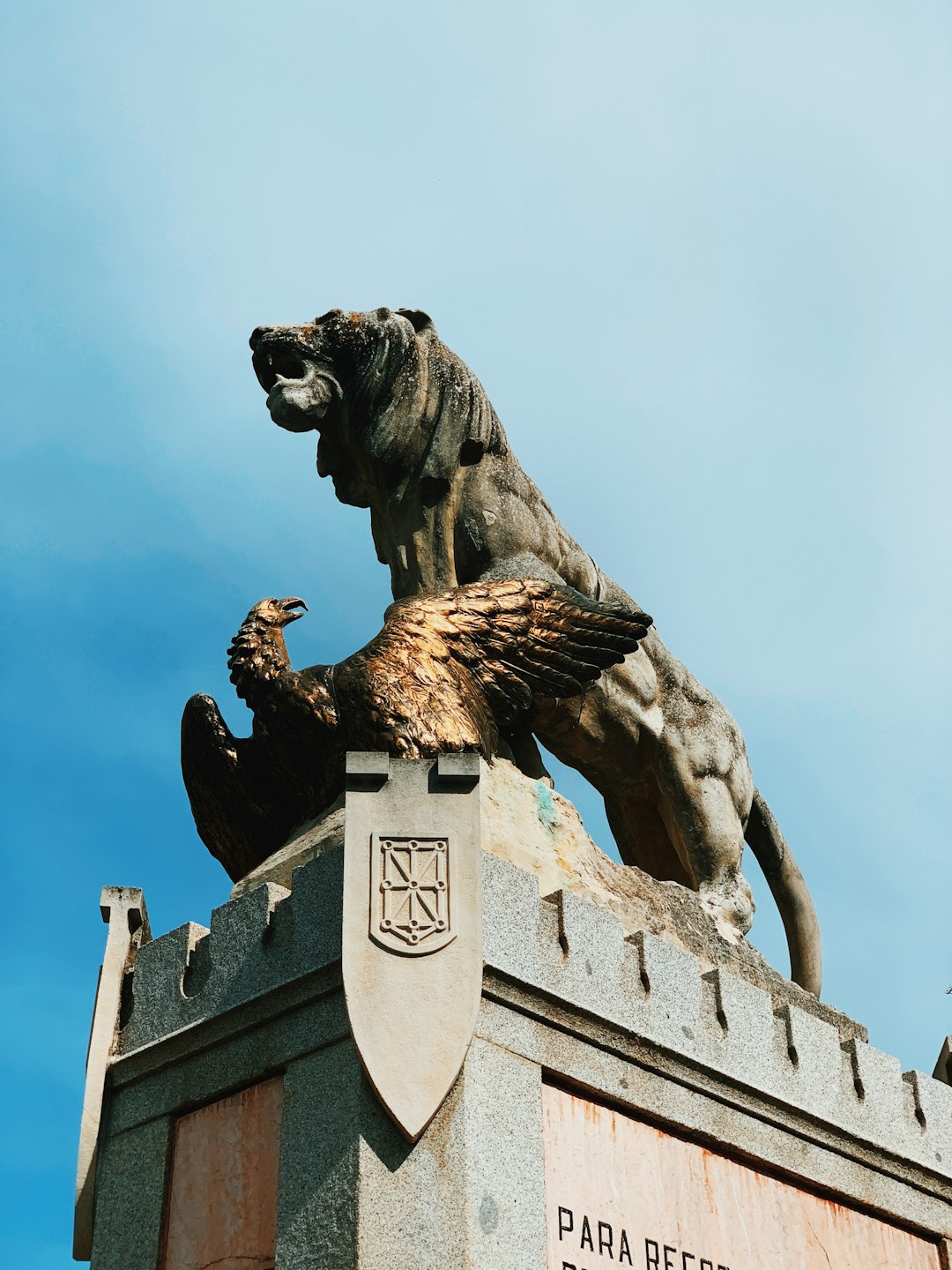 brown lion and brown bird statue