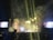 A large crowd gathers at a concert with bright stage lights and a shower of confetti falling over the audience. Large screens flank the stage, displaying colorful visuals. The atmosphere is lively, with people enjoying the event and some raising their hands in excitement.