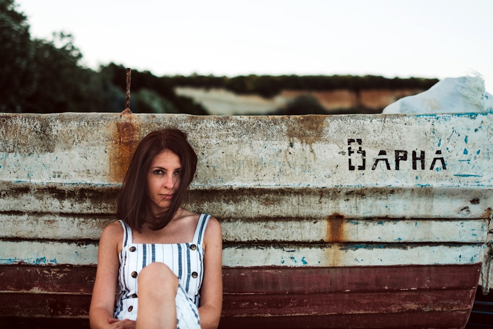 shallow focus photo of woman in white and black thick strap top