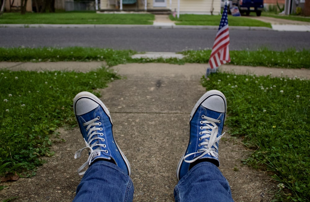 person wearing blue sneakers