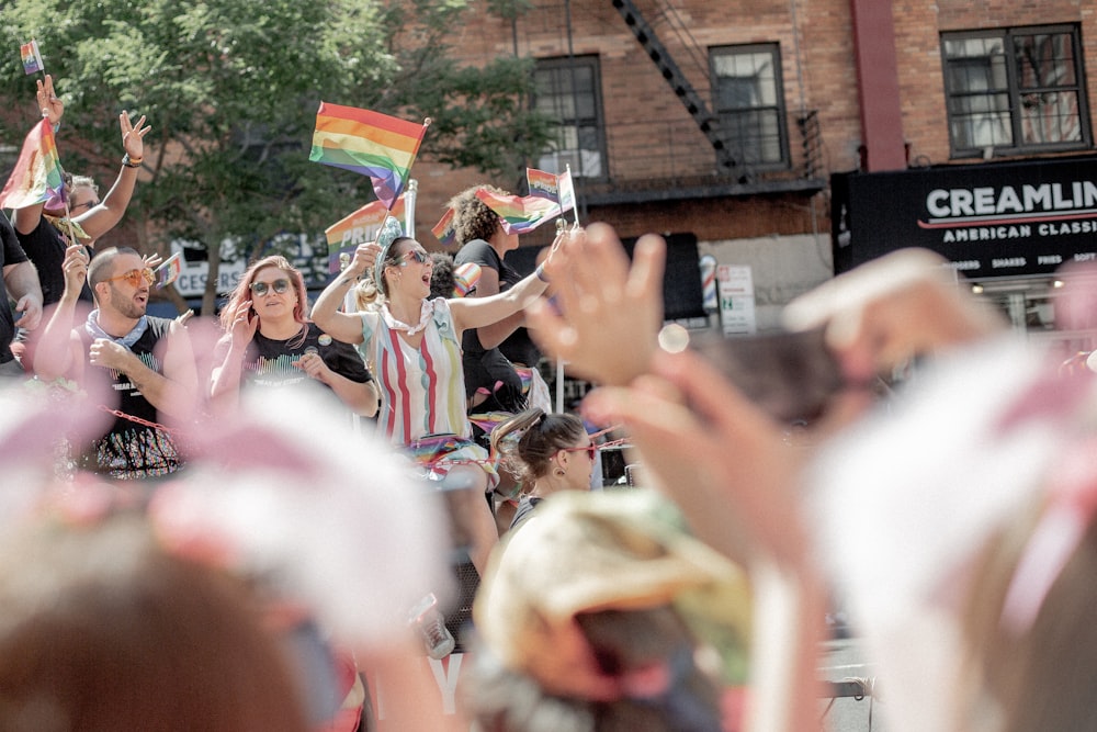LGBT community rallying on street near buildings