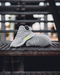 pair of grey shoes on stair