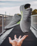 pair of gray running shoes