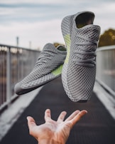 pair of gray running shoes