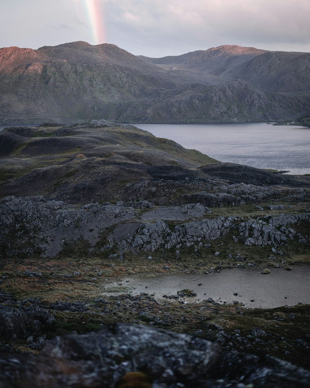 body of water near mountain