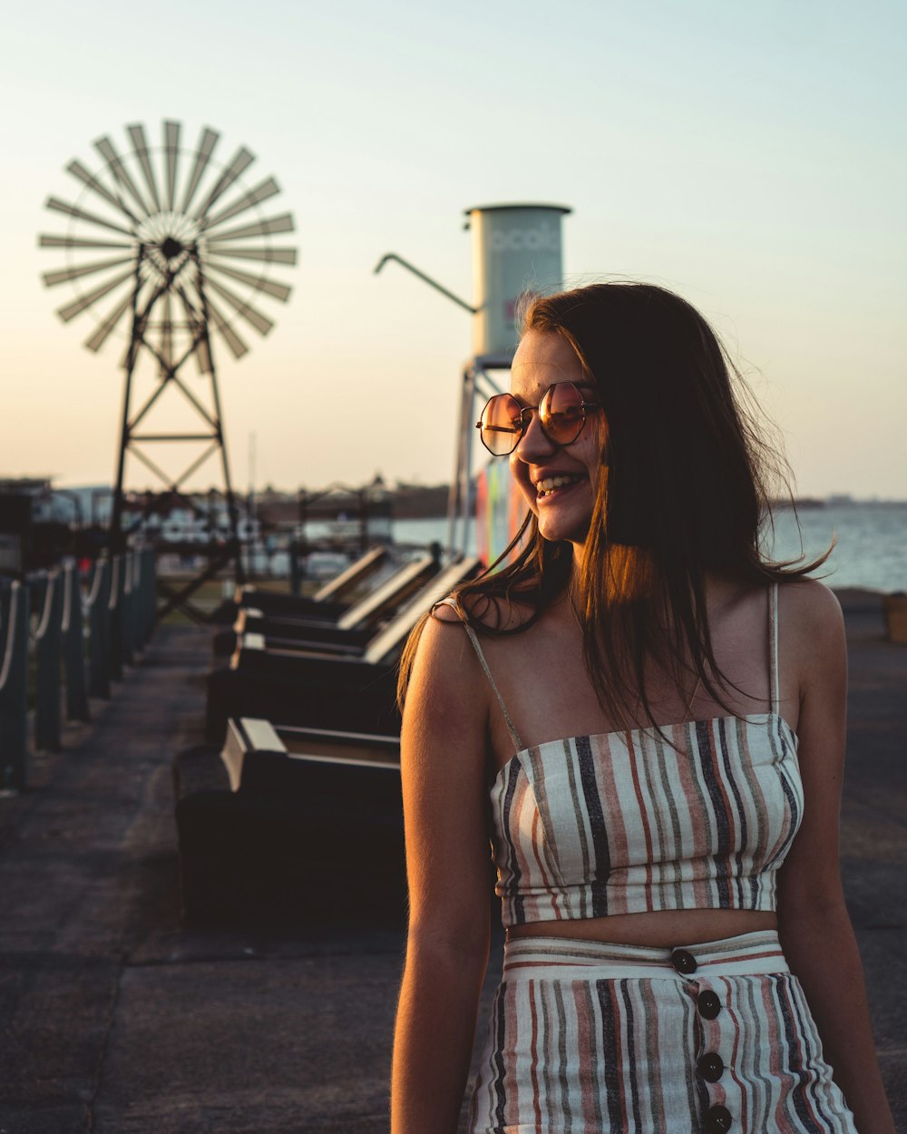 woman wearing white spaghetti-strap top