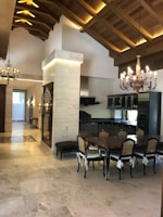 A stylish dining area with elegant chairs and a table.