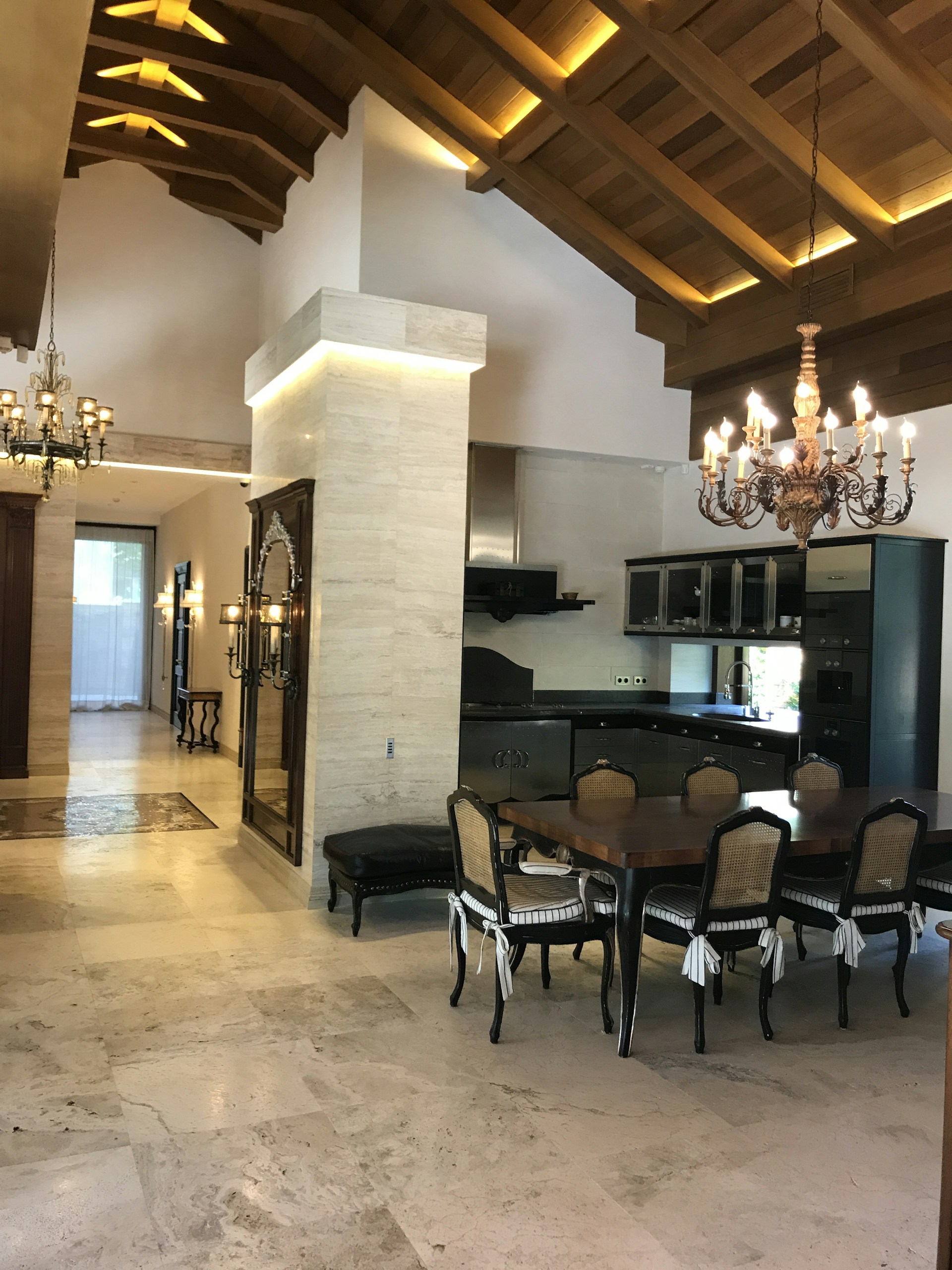 A spacious dining area with a sleek table surrounded by comfortable chairs.