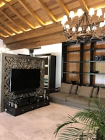 Modern TV stand in a cozy living room with natural wood and beige tones.
