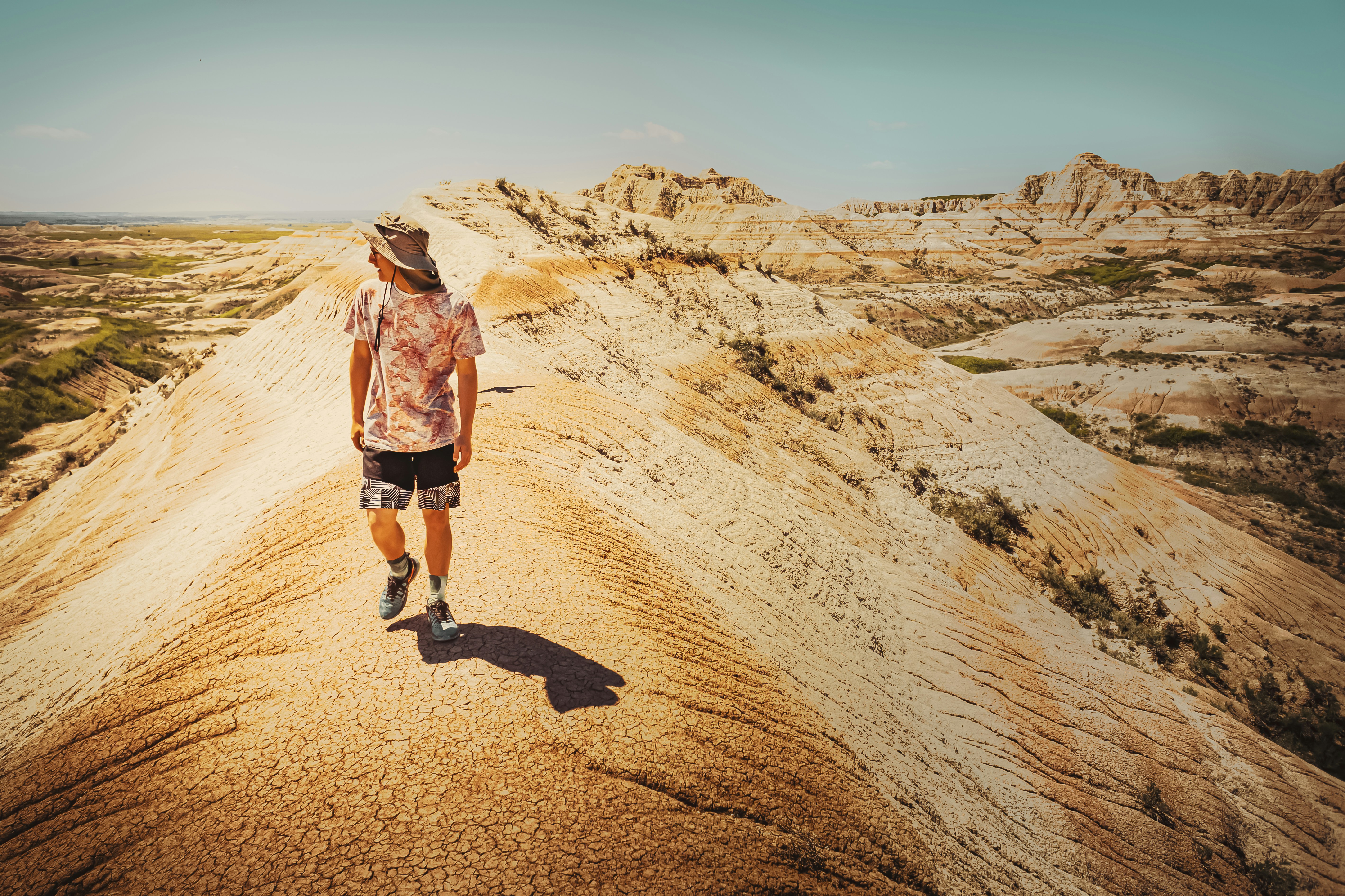man walking on a rocky mountain, 