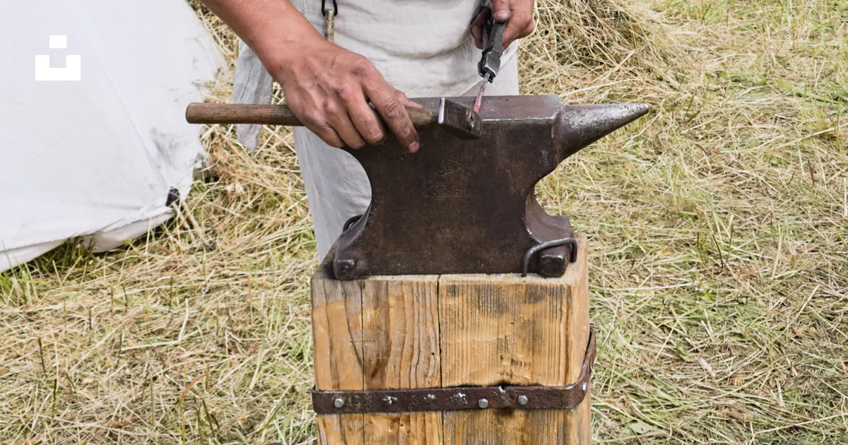 Locksmith hammering in an anvil photo – Free Grey Image on Unsplash