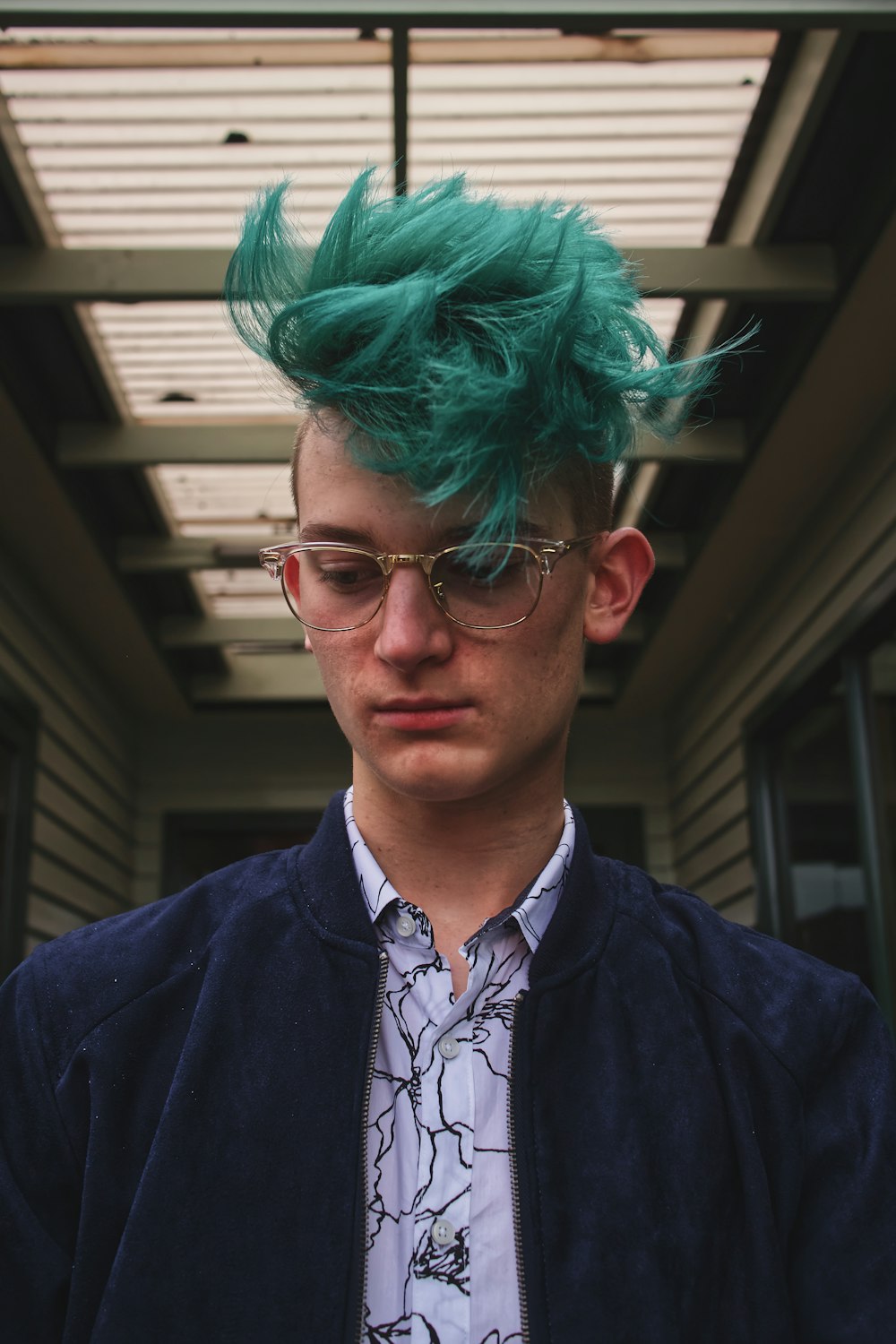 man's green dyed hair