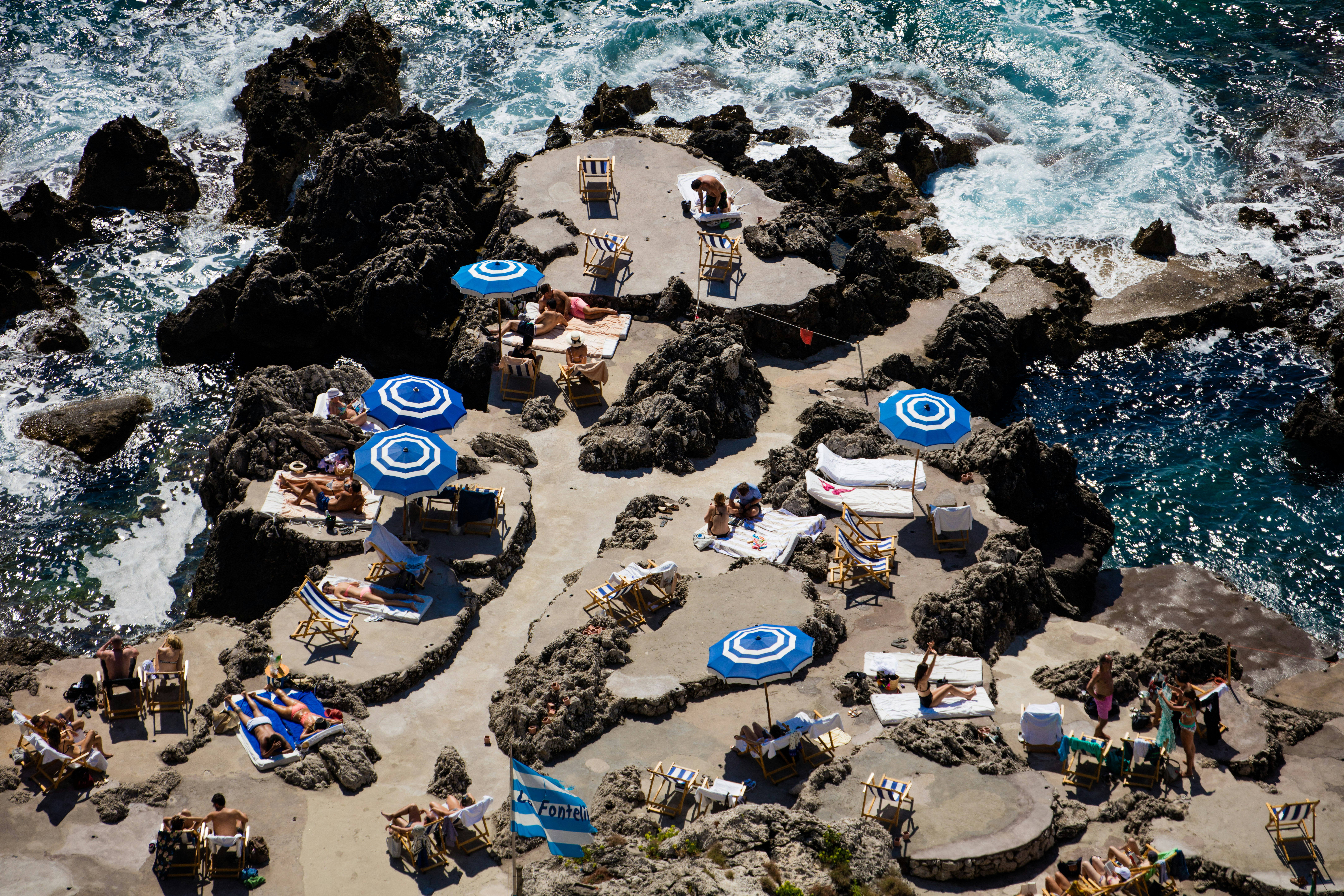 people sun bathing