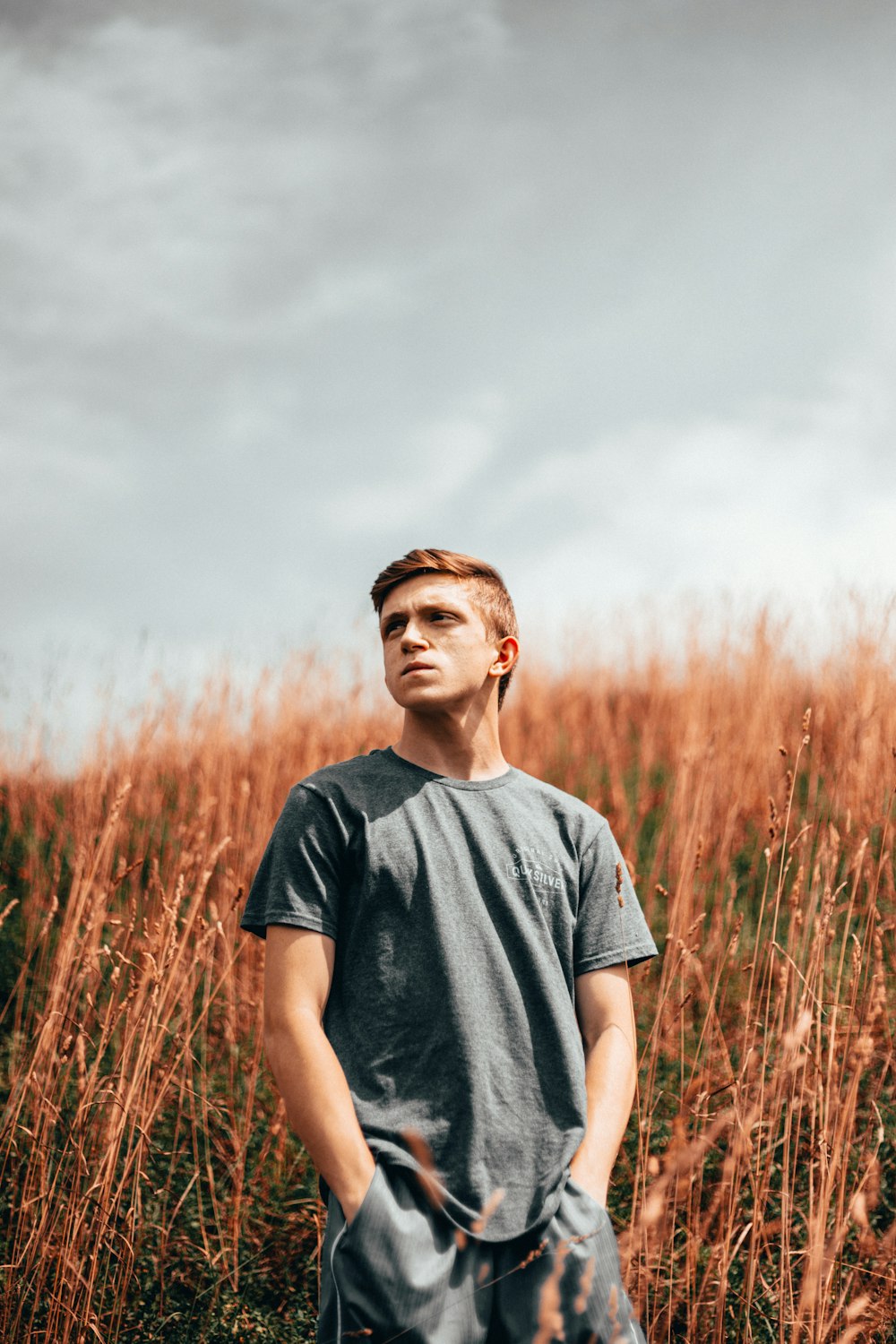 man wearing black crew-neck t-shirt