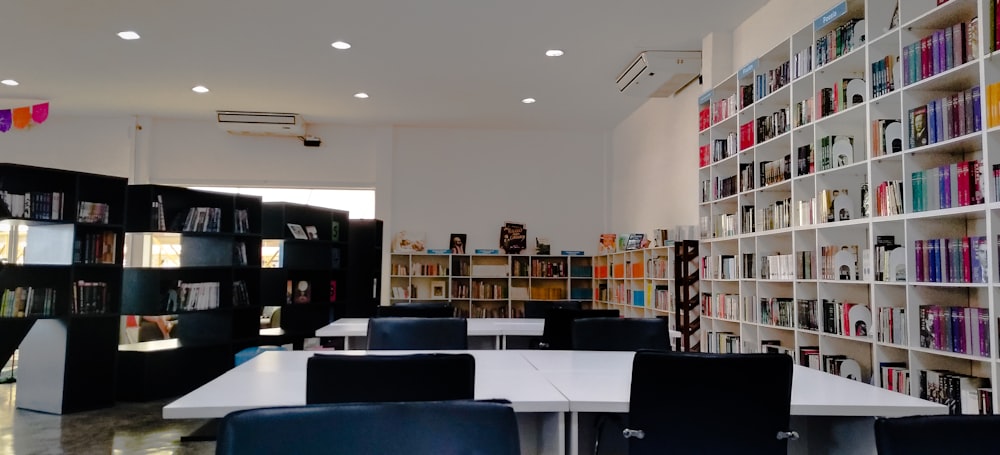 tables and chairs inside a library