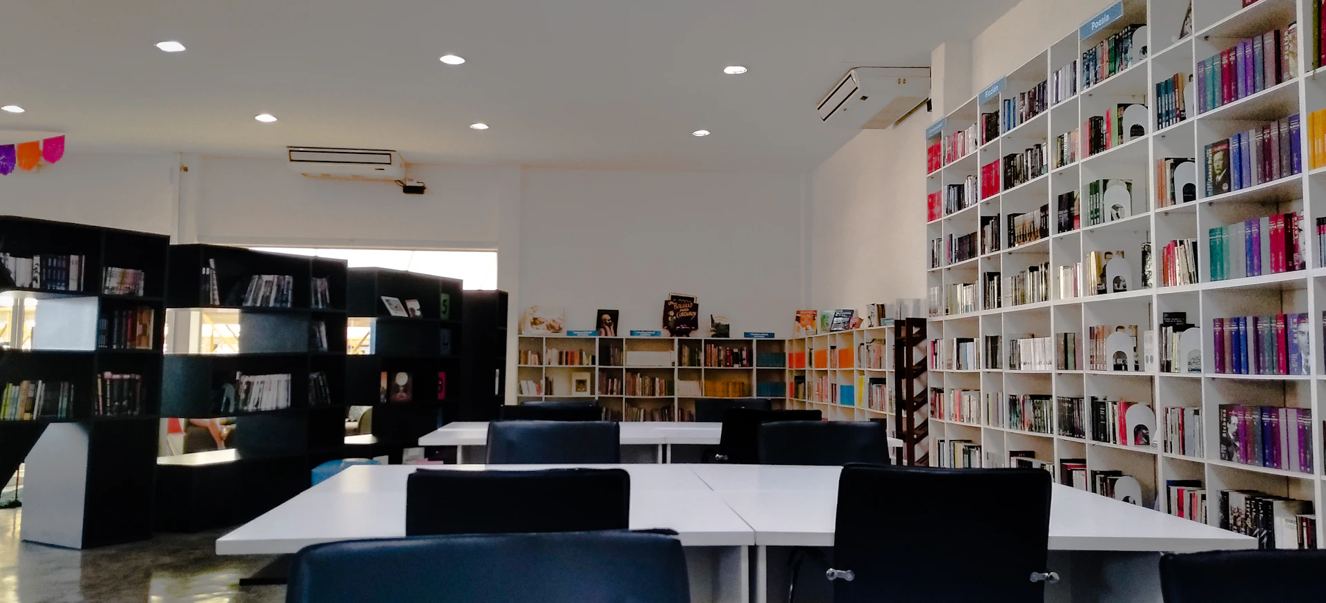 tables and chairs inside a library