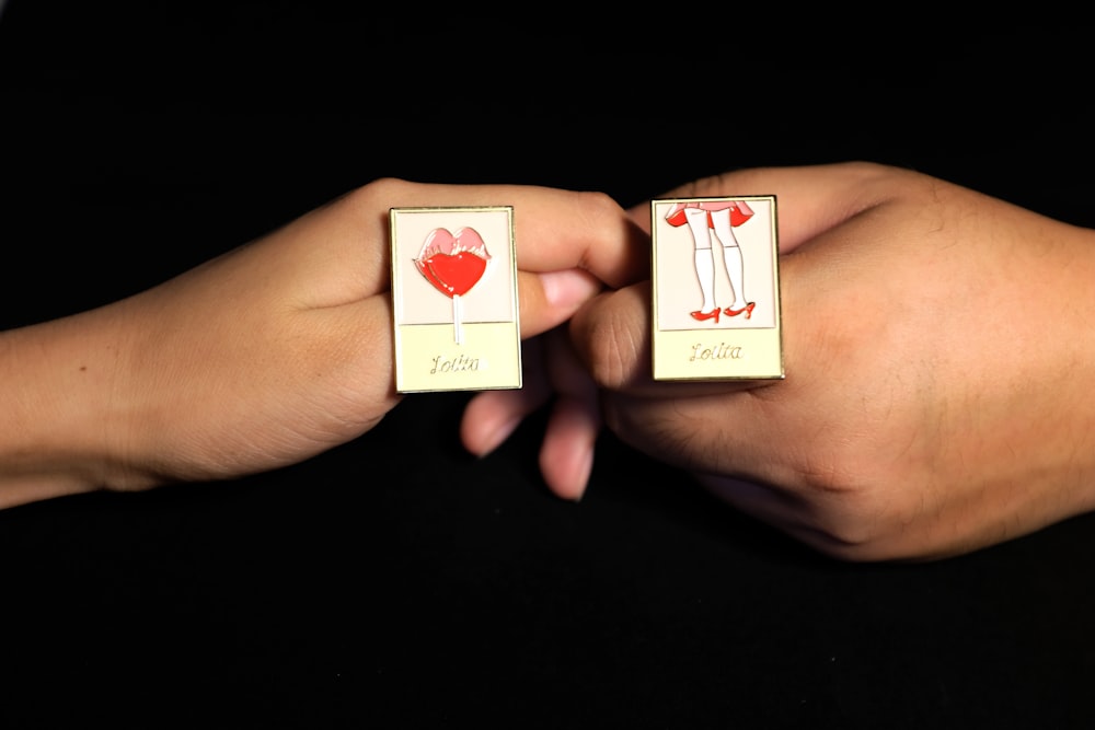 white-and-red couple button pins