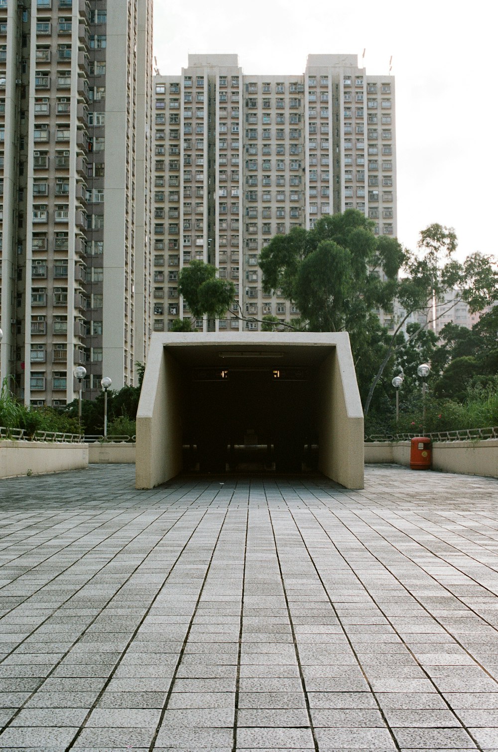 white concrete walkway arch near buildings