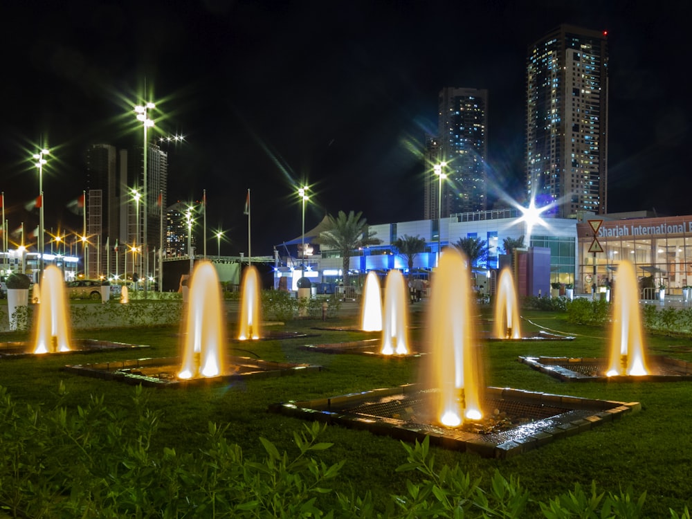 dancing fountains at the lawn during nighttime