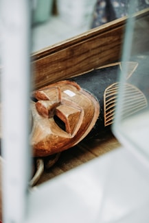 brown and black wooden tribal mask