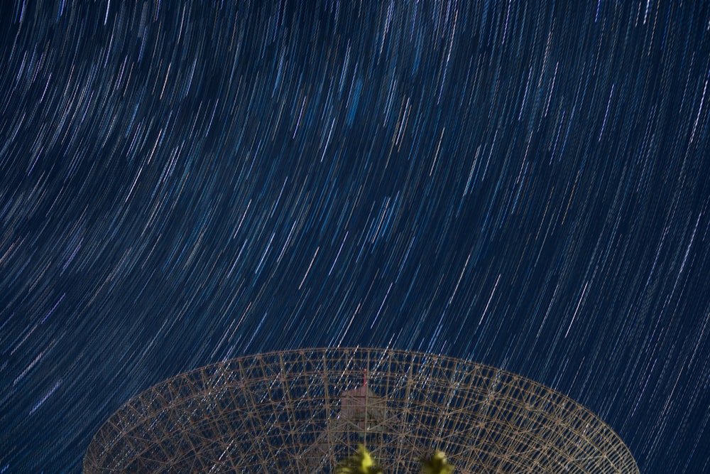 time-lapse photography of satellite antenna under sky