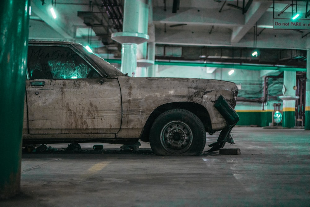 white vehicle parked in garage