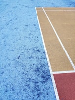 Modern sports court with clean, industrial design elements and durable materials.