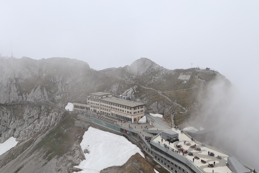 aerial photography of gray building on mountain during daytime