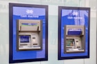 two blue and black Halifax Cash Machines