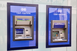 two blue and black Halifax Cash Machines