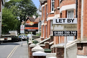 let by signage outside terrace housing empty properties