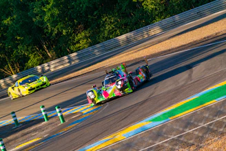Colorful racing game screen showing cars speeding on a futuristic track