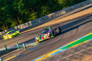 A close-up of colorful pixelated race cars speeding on a digital track, capturing the excitement of the game.