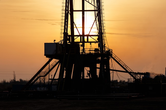 A stunning offshore oil rig at sunset.