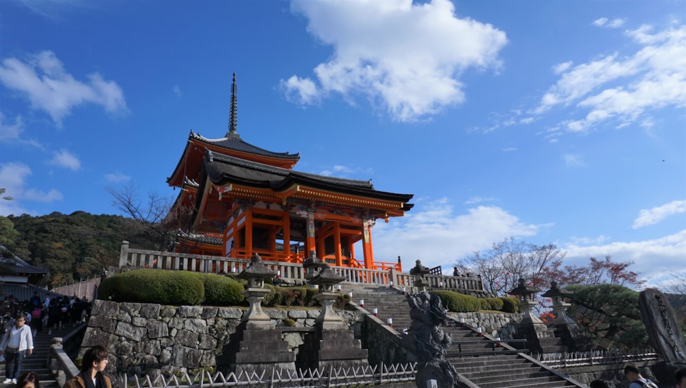 red and black temple at daytime