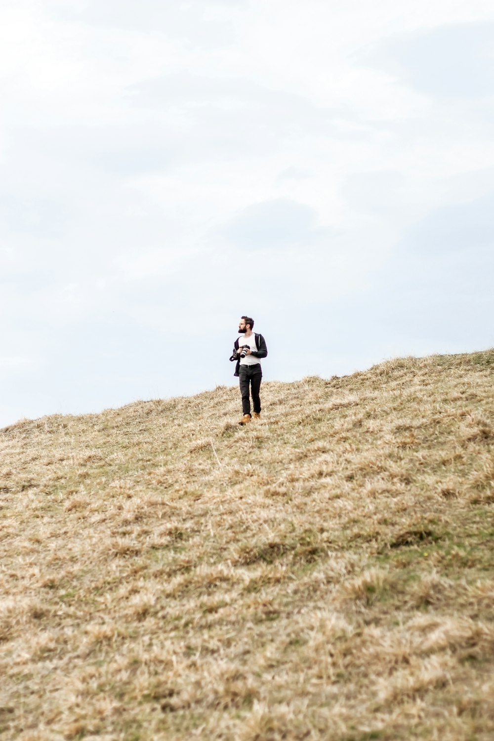 man standing in open field