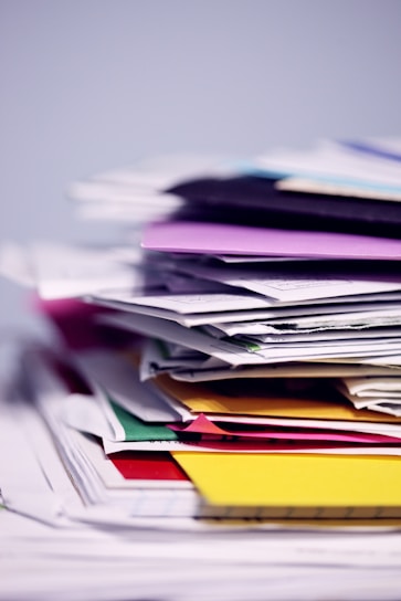 messy stack of folders and paper