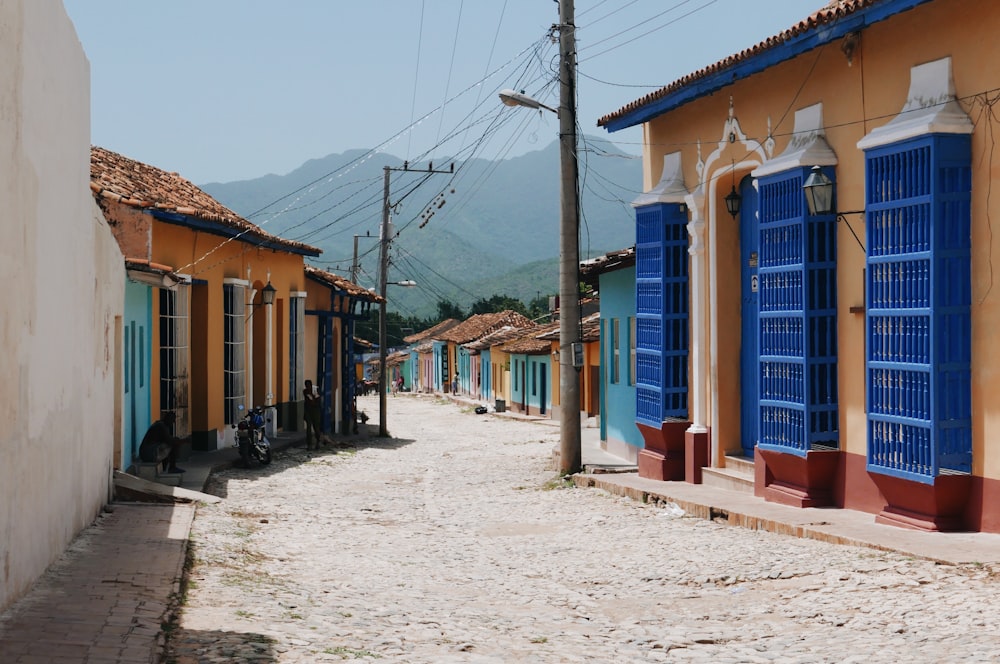 brown and blue houses at daytime