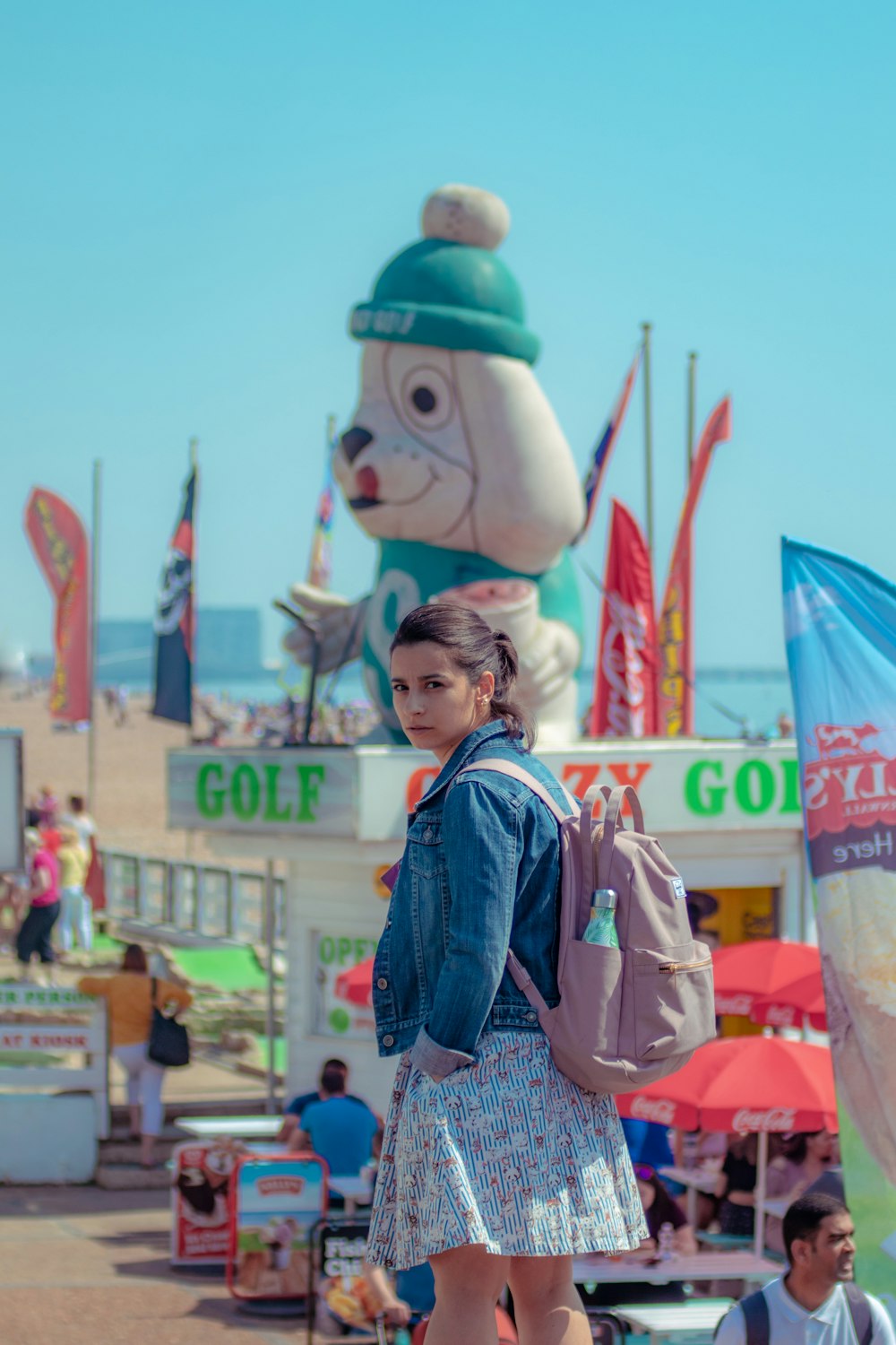 shallow focus photography of woman standing near golf storefront