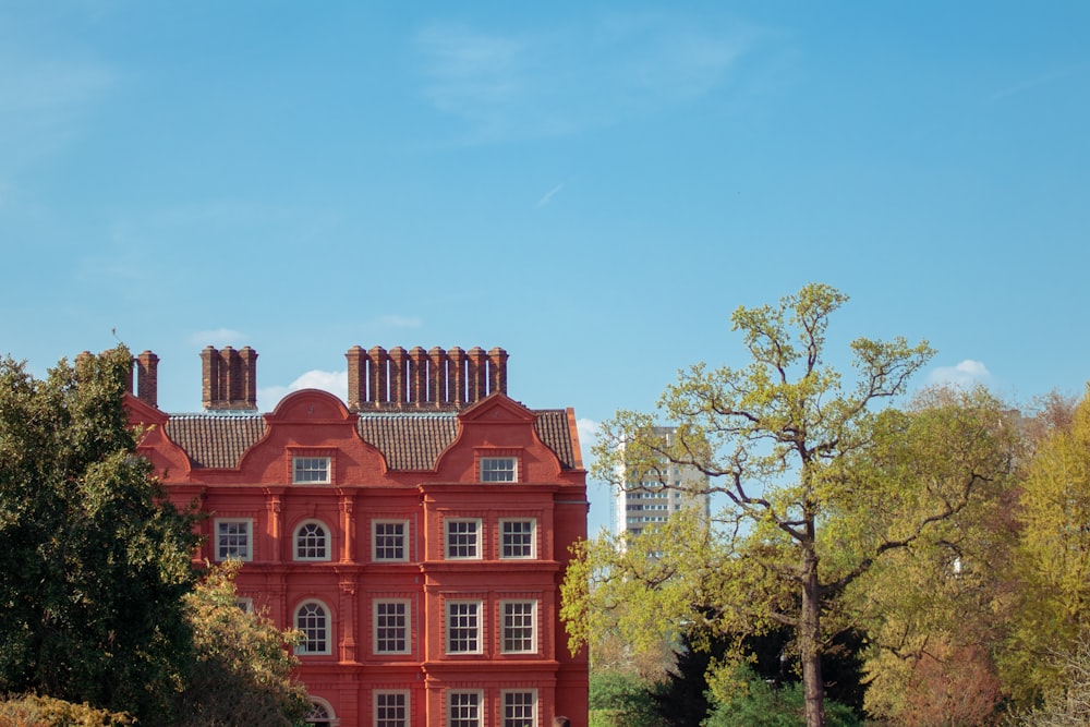 red concrete building under clear blue sky