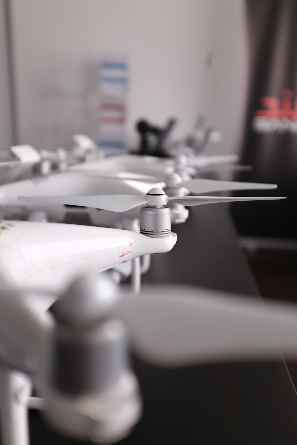 several white drones lining up on table