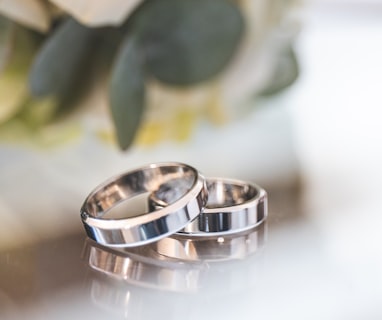 silver-colored wedding bands