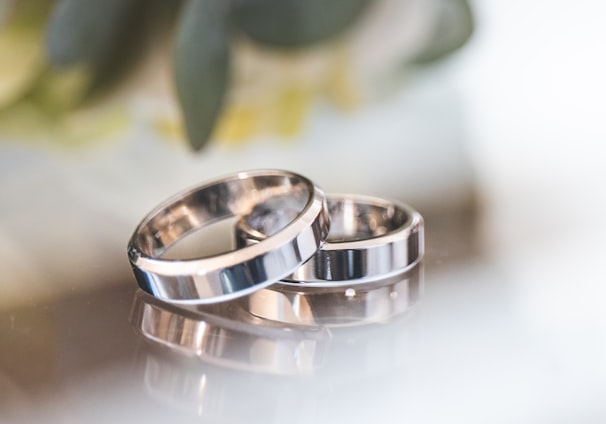 silver-colored wedding bands