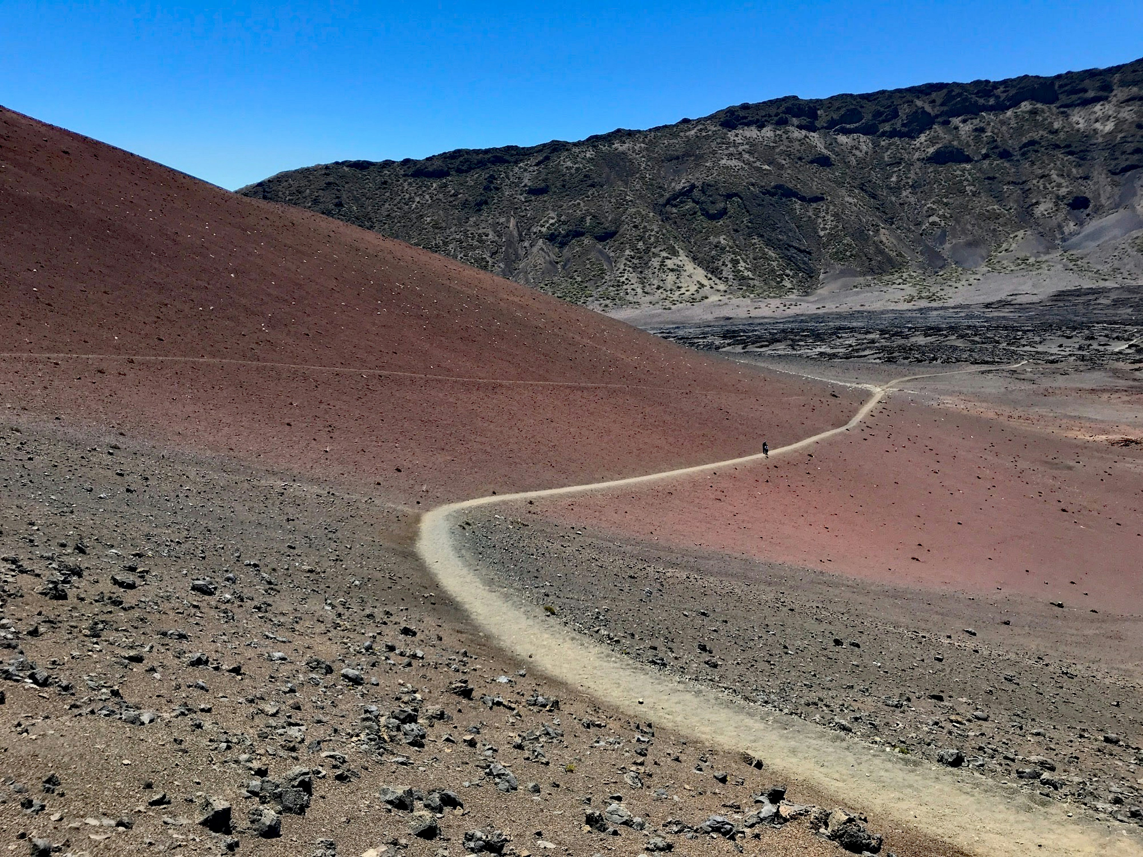 person walking on hill